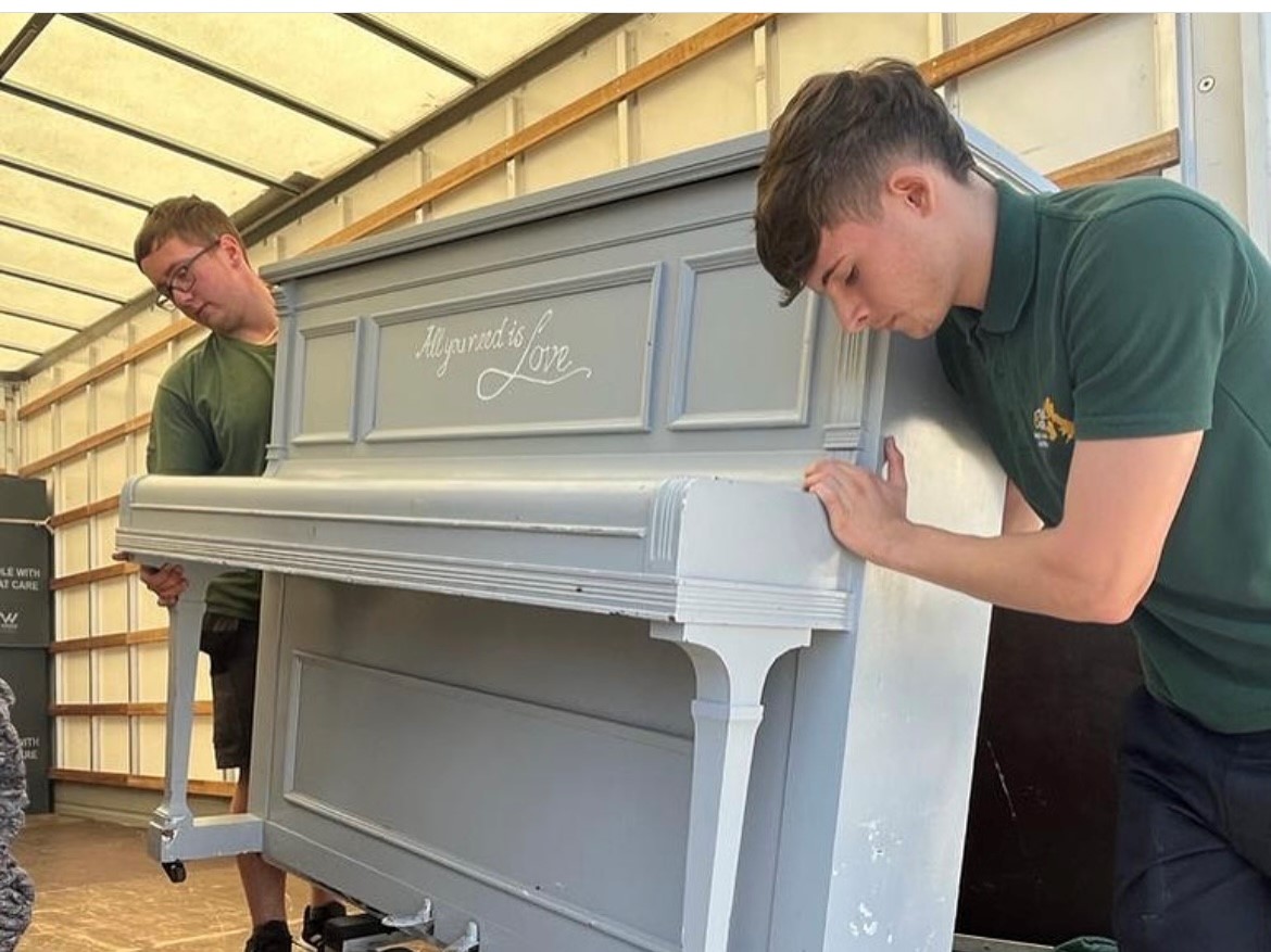 Piano movers London securing a piano for safe transport